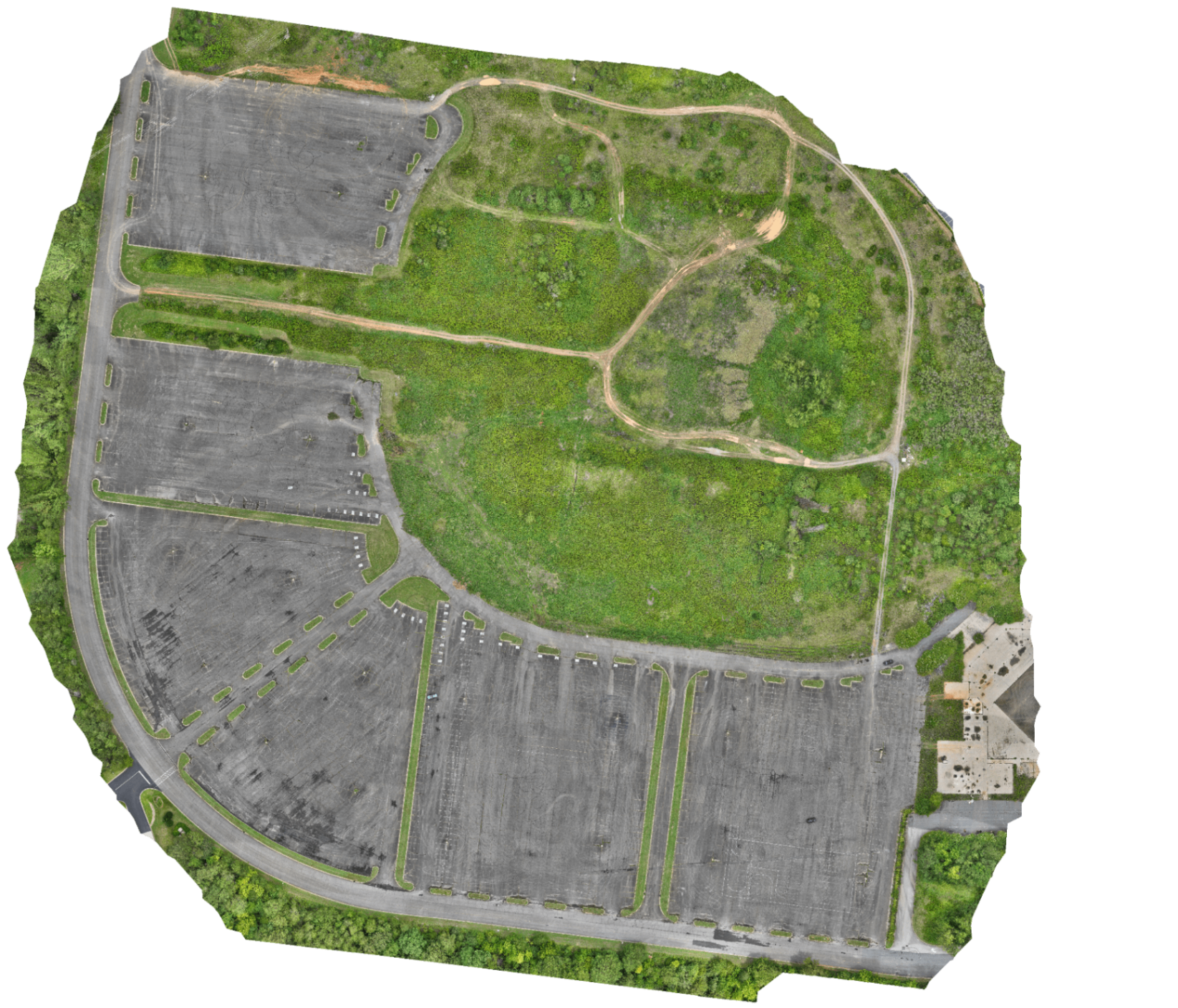 Aerial orthomosaic of a commercial parking and vacant lot site