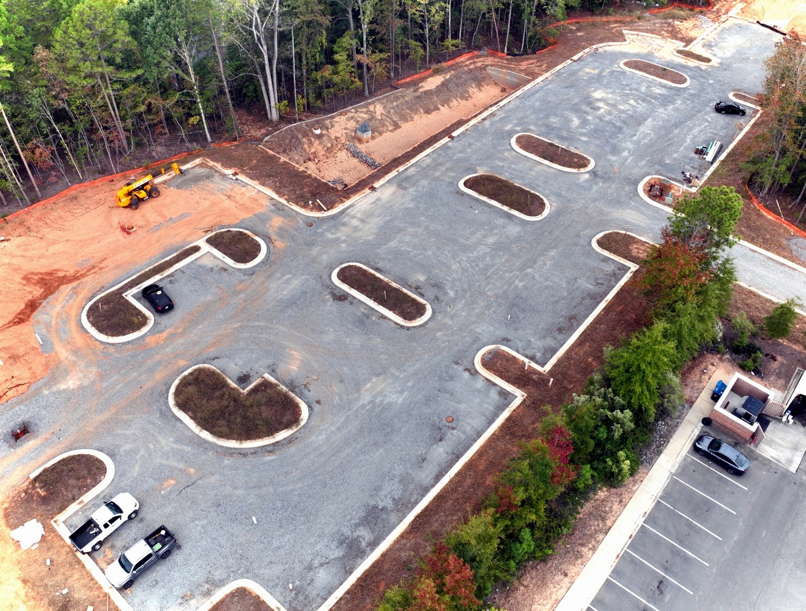 Site progress capture — asphalt and landscape islands